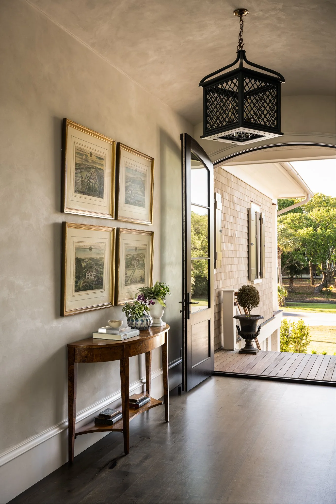 Bright coastal entryway with a console table, mirror, and layered natural textures.